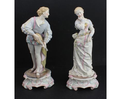 A large pair of 19th century hand-decorated German porcelain figures: male and female in early-style dress, the male with a l