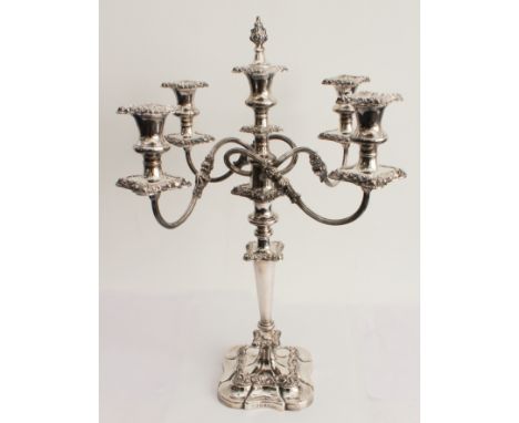 A large and fine hallmarked silver five-light table candelabra: the central candleholder with a snuffer modelled as flowerhea