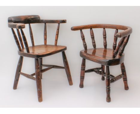 A matched pair of childs' captain's-style chairs. One late 19th century, in beech and oak with ring turned spindle back, sadd