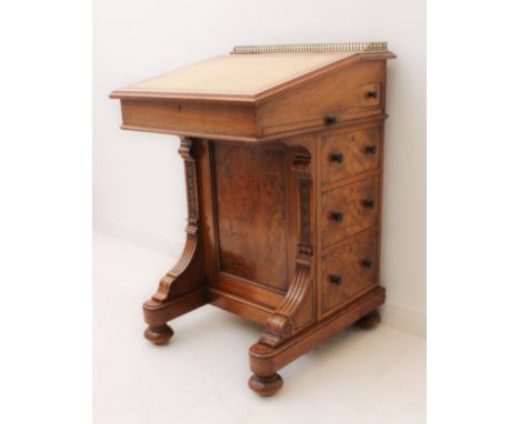 A&nbsp; third quarter 19th century walnut Davenport by Gillow &amp; Co. (stamped top side of top left drawer and front sectio