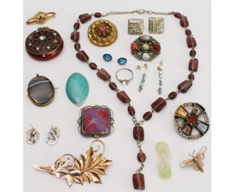 A small collection of costume jewellery to include an interesting enamel brooch and an unmounted Ruskin Pottery stone.