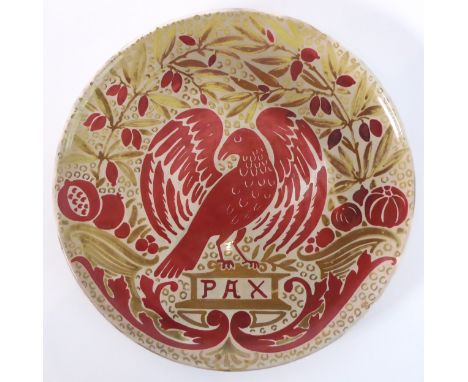 A late 19th century Maw & Co. Art Pottery charger: centrally decorated with an open-winged dove over a plinth inscribed 'PAX'