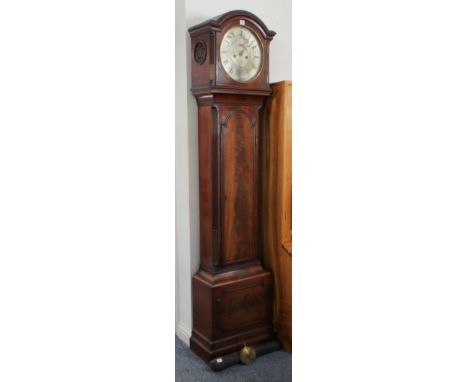 A George III period mahogany eight-day longcase clock: the arched moulded cornice above a 12-inch circular silvered dial with