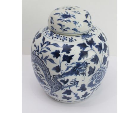 A Chinese blue-and-white ginger jar and cover decorated with dragons between foliage and painted four-character mark to base,