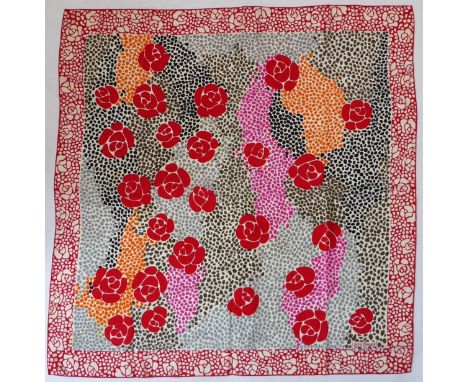 A Laura Biagiotti silk scarf in a striking design of stylised red roses (approx. 85 x 87.5 cm).* Condition: A few small marks