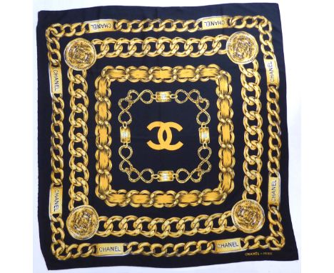 A Chanel silk scarf (approx. 85 x 90 cm).* Condition: One edge has become unhemmed, otherwise good.