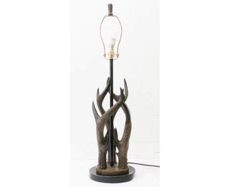 A modern faux antler table-lamp: the three 'antlers' mounted on a stepped bronzed and black painted base, no shade. (79 cm hi