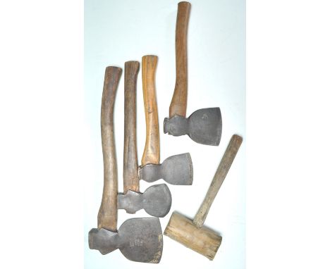 A group of four vintage hand axes together with an old wooden mallet. Some axes bearing names to include Makers Cornell of Ca