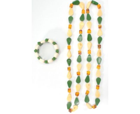 A pair of Chinese style amber jade &amp; ivory style necklaces together with a matching bracelet, both having alternate green