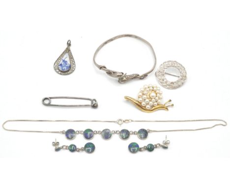 A collection of silver and costume jewellery to include azurmalachite necklace and earring set. A signed delft pendant, large