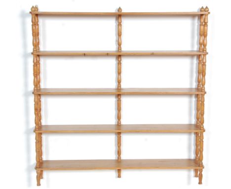 A good late 19th Century Victorian pine shelf rack having five shelves supported spindle turned supports. Measures 103x100x15