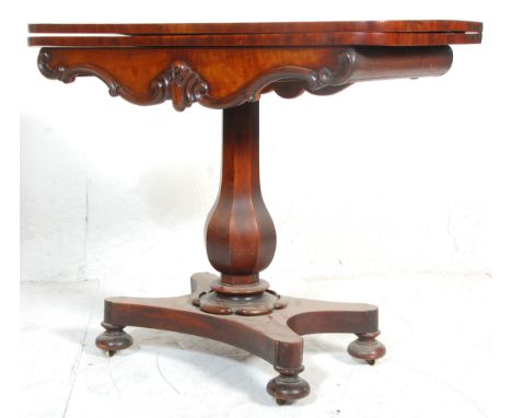 A 19th century Regency William IV mahogany card - games table. Raised on a quadruped base with bun feet having a tapering bul