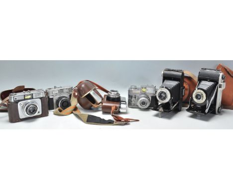 A collection of vintage film cameras to include an Ilford Sportsman, Halina Rolls, a Koroll II camera, a Kodak Brownie bellow