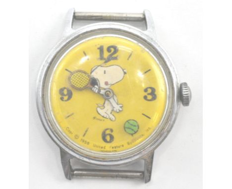 A rare 1958 Timex Snoopy wristwatch with yellow dial. The Timex movement in stainless steel case with rare yellow dial face.&