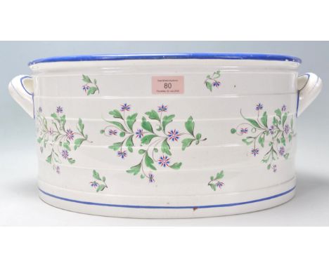 An antique 19th century Victorian Copeland Spode made ceramic footbath. Decorated with florals to the body, with a blue paint