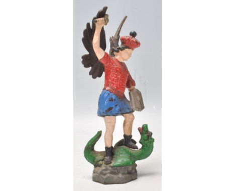 An early 20th Century Vintage cold painted cast spelter figure of George and the dragon depicting Saint George stood on the d