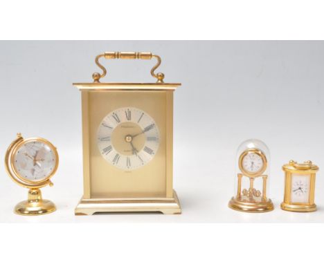 A vintage 20th Century brass cased carriage clock by President having gilt brushed design interior with silvered roman numera