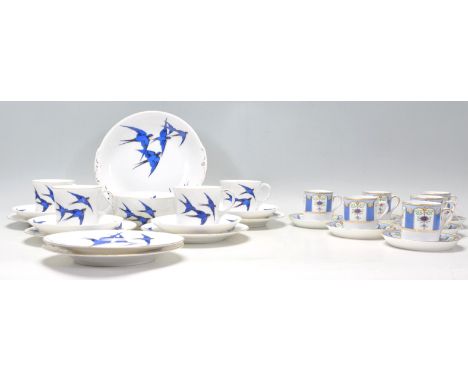 A vintage Tuscan China part coffee service compressing of six coffee cans and saucers having blue panels with floral decorati