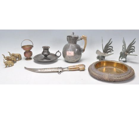 A collection of antique metal ware items to include an Islamic middle eastern curved blade dagger having a horn handle, an an