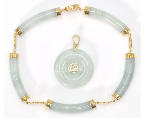 A 14ct yellow gold and jade Chinese&nbsp; bracelet and necklace pendant suite. The doughnut shaped roundel pendant and bar li