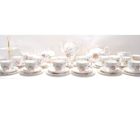 A Fine Bone China English tea service by Queen Anne China in the Old Country Spray pattern having floral decoration. The serv