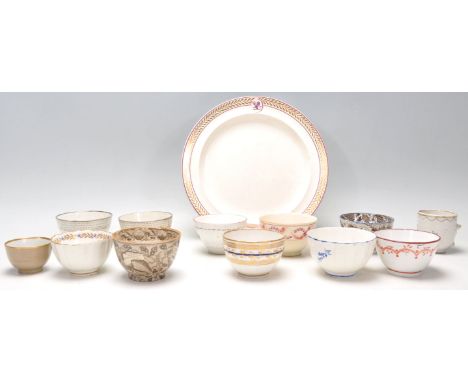 A collection of 18th and 19th Century Georgian English porcelain cups / tea bowls to include two transfer printed shell cups,