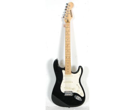 A Fender Stratocaster style Bluerock six string electric guitar having three control knobs with a black finished body and whi