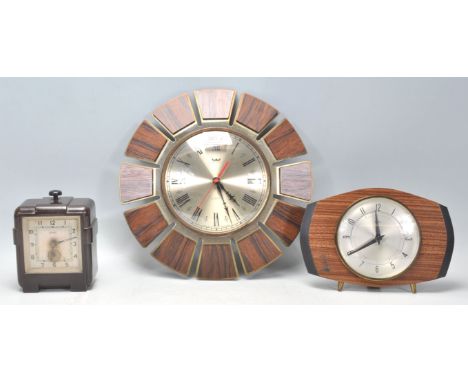 A group of three vintage retro clocks to include an Art Deco Ferranti bakelite cased electric clock, a retro Smiths Astral wa