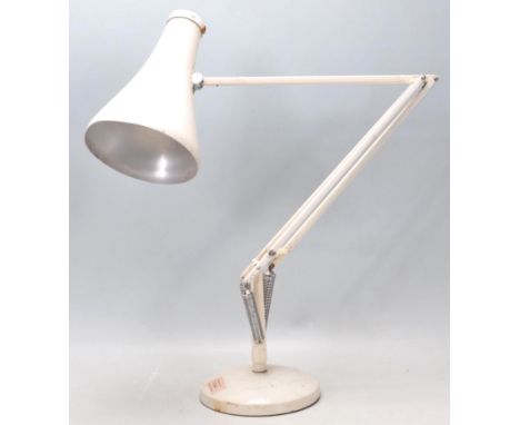 A vintage 20th Century Herbert Terry Anglepoise industrial desk lamp finished in white enamel colourway. Raised on circular b