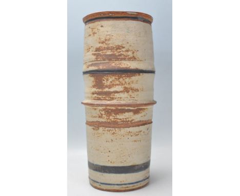 ROBIN WELCH (1936-2019) - A large retro studio art pottery stoneware cylindrical vessel / vase decorated with polychrome eart