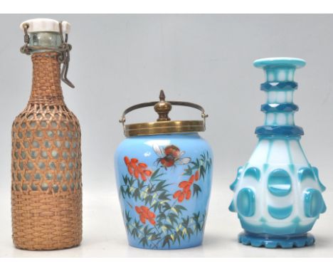 A collection of glassware to include a vintage Bohemian flash cut blue and white bottle vase, a Victorian opaline glass prese