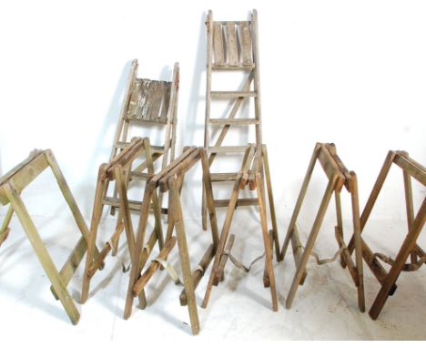 A set of six 20h Century industrial wooden trestles / table stands together with two vintage folding step ladders of planked 