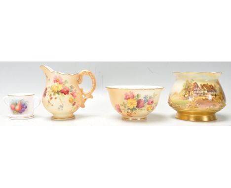 A group of four Royal Worcester vases to include a&nbsp;with sheep in front of a thatched cottage Nr Evesham decoration, sign