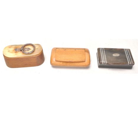 A good antique olive wood snuff box having a horn cover top and hoop handle. Together with a Georgian horn snuff box with sil