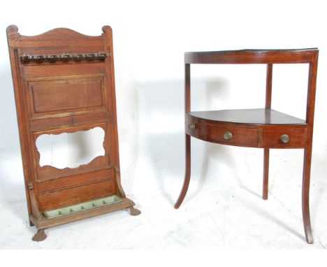 A 19th Century antique mahogany George III corner side table having a circular front with two tiers of shelves, the lower hav