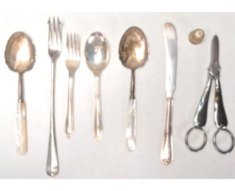 A collection of antique silver and silver plated items to include two Victorian mother of pearl handled silver spoons with en
