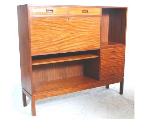 A brilliant mid 20th Century retro teak wood bureau desk / bookcase having two drawers above a drop down front revealing a fi