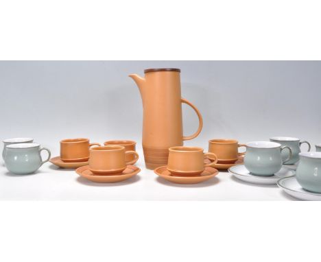 A vintage retro 20th Century Purbeck pottery coffee service consisting of four brown glazed coffee cups and saucers with coff