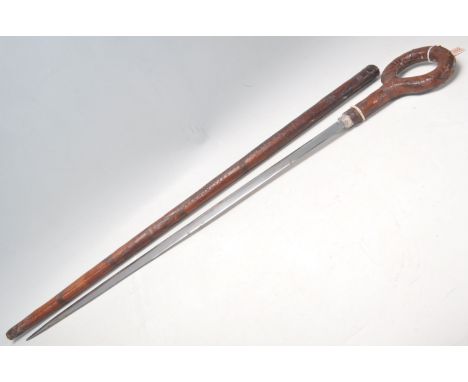 A 19th Century Victorian sword stick / walking stick having leather covered&nbsp;scabbard and hoop handle having leather work