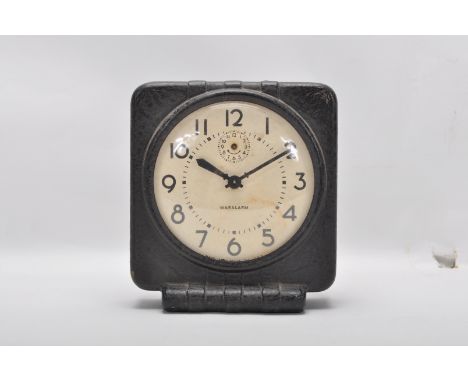 A mid 20th Century WWII era American Cardboard Waralarm War alarm clock made in 1944 by Western Clock Co, La Salle, Illinois,