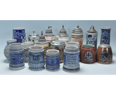 A collection of 20th Century German ceramic stein drinking glasses, many having raised blue and grey decoration, also includi