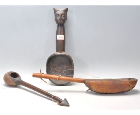 A group of three African tribal wooden objects to include a Dan tribe Liberian carved wooden ceremonial spoon / ladle, the ha
