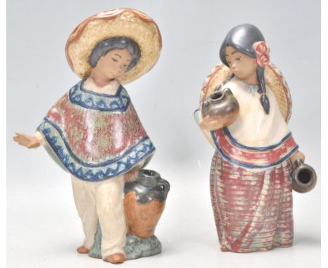 A pair of Lladro ceramic figurines in the form of a Mexican boy wearing a Sombrero and a poncho together with a Mexican girl 