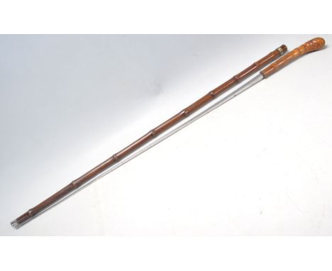 A vintage 20th Century bamboo sword stick / walking stick cane of slim form having a root knot ball knob to top. Measures 91c