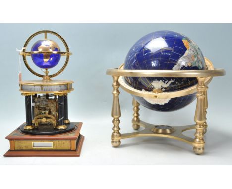 A 20th Century desk top ornamental blue terrestrial globe raised on a brass gimbal stand with knopped legs together with an u