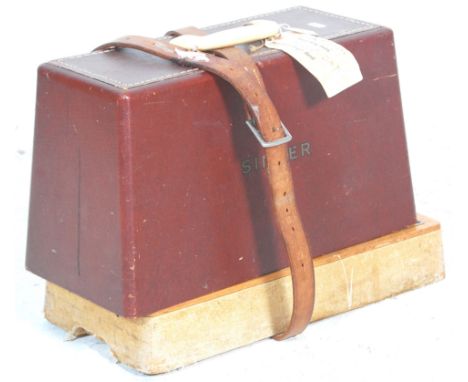 Two vintage retro 20th Century electric sewing machine to include one by Singer with a red leather case and the other by New 