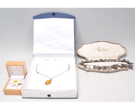 A collection of vintage jewellery to include a silver necklace having an amber cabochon pendant,together with a vintage ceram