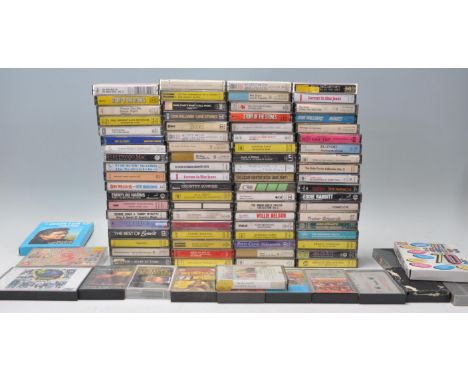 A collection of retro vintage music cassette tapes to include Dolly Parton, Rolling Stones, Blondie, Willie Nelson, Fleetwood