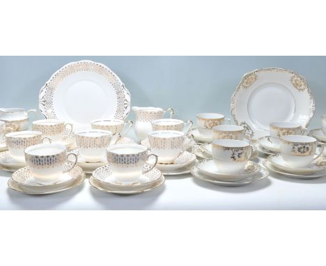 A mixed group of three&nbsp;Fine Bone China English gilt part tea services. One service by Queen Anne China comprising four c