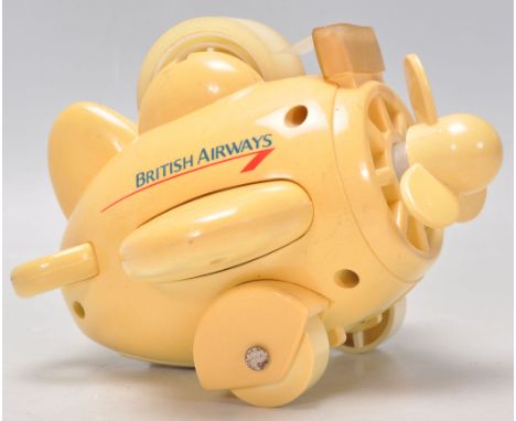 A vintage 1980s British Airways advertising desktop stationery multi tool in the form of a plane, with each part opening to r